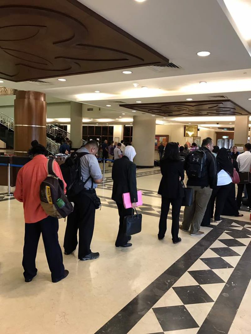 The queue for e-filing as seen at 7.56am on June 22, 2017, stretching past the reception desk and main glass doors at the KL court complex. — Picture by a Malay Mail Online reader 