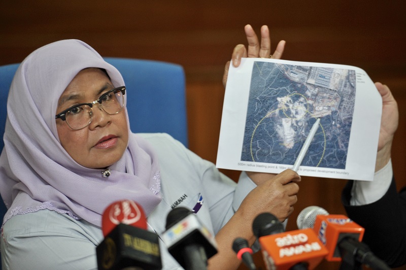 MBPP Mayor Datuk Maimunah Sharif shows the location of the 49-storey affordable housing project in Tanjung Bungah where the deadly landslide occurred.