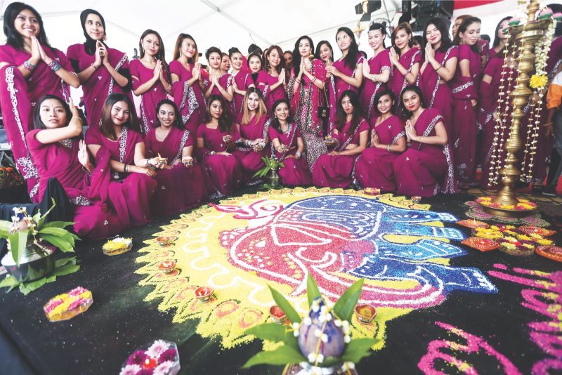 Saree-clad beauties ushering in guests at the MyPPP Deepavali open house held at Little India, Brickfields. u00e2u20acu2022 Malay Mail picnn