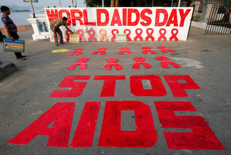 A man places a placard as he prepares a message during an HIV/AIDS awareness campaign on the eve of World AIDS Day in Kolkata November 30, 2017. u00e2u20acu201d Reuters pic