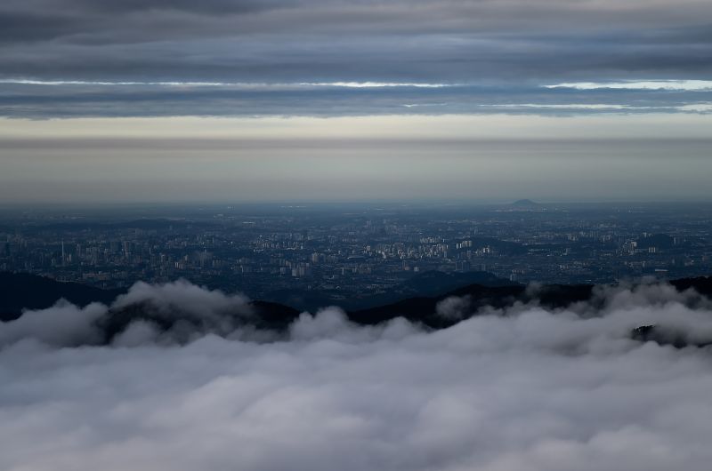 This general view shows Kuala Lumpuru00e2u20acu2122s skyline seen above low-level clouds from the hilltop holiday area of the Genting Highlands on December 2, 2017. u00e2u20acu2022 AFP pic