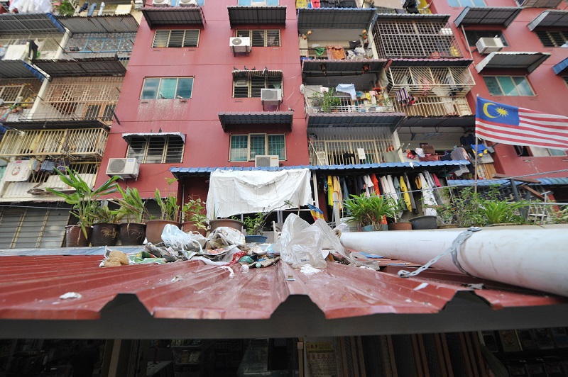Rifle Range residents often threw rubbish out their balconies, most of which fall on the awning on the ground. u00e2u20acu201d Picture by KE Ooi