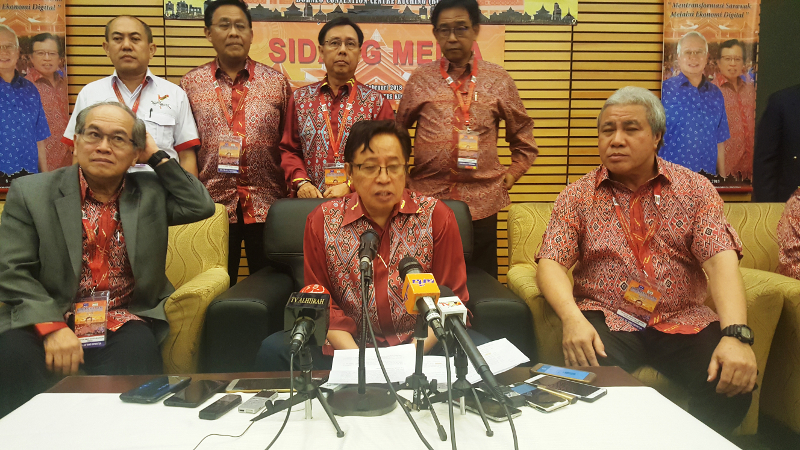 Chief Minister Datuk Patinggi Abang Johari Openg (centre) speaks to reporters, says Petronas must comply with the state law, February 11, 2018. u00e2u20acu201d Picture by Sulok Tawie