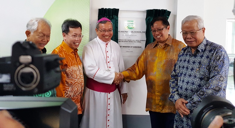 Sarawak Chief Minister Datuk Patinggi Abang Johari Openg (second right) poses for a group picture with Archbishop of Kuching Simon Peter Poh (third left) at the opening of St Joseph International Private School in Kuching March 3, 2018. — Picture by Sulok Tawie
