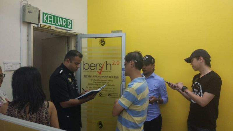 A police officer from the Dang Wangi police station writing down Yap particulars at the Bersih 2.0u00e2u20acu2122s office in Petaling Jaya this morning, March 30, 2018. u00e2u20acu2022 Picture courtesy of Bersih 2.0