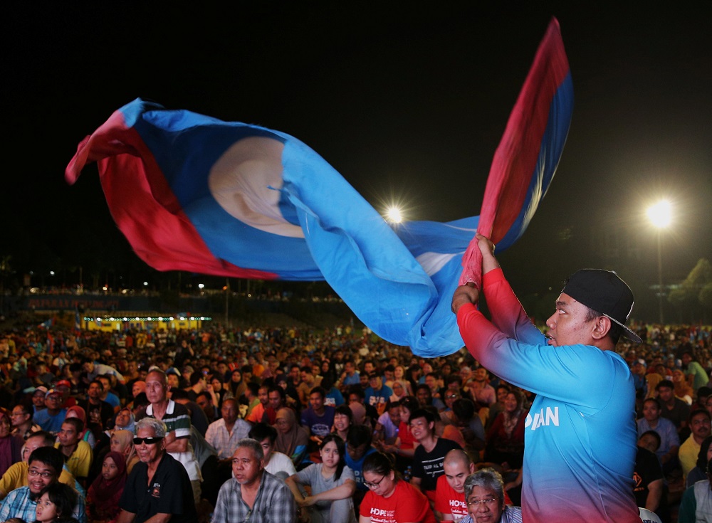 Pakatan Harapan supporters gather as they wait in anticipation for the results of the general election to be announced, in Petaling Jaya May 9, 2018. — Reuters pic