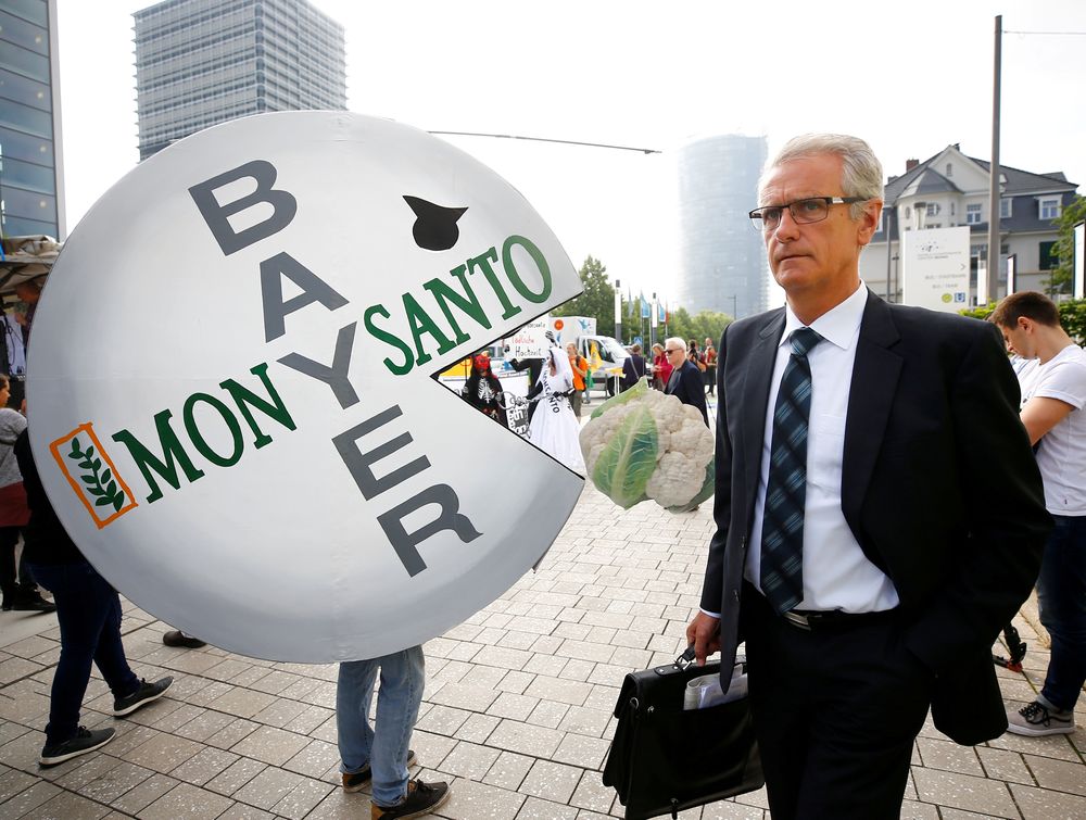 File picture shows a Bayer shareholder arriving at the annual general shareholders meeting as people protest against the merger of Germanyu00e2u20acu2122s Bayer with US seeds and agrochemicals company Monsanto, in Bonn, May 25, 2018. u00e2u20acu201d Reuters pic