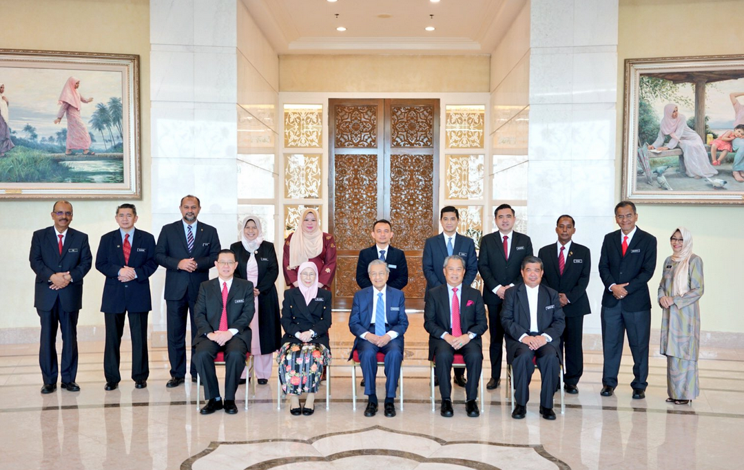 Dr Mahathir (centre) and members of the Cabinet pose for a group picture in Putrajaya on May 23, 2018. u00e2u20acu201d Picture via Twitter/AzminAli