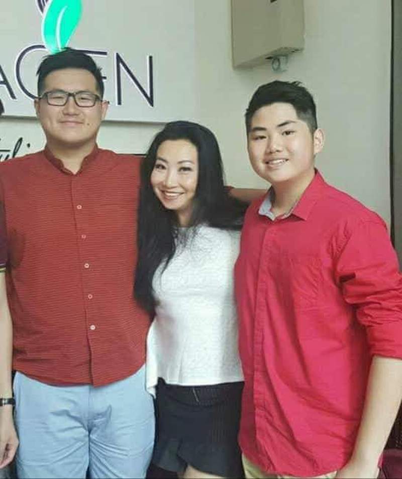 Florence with sons, Zenvern (left) and Brandon Tan.