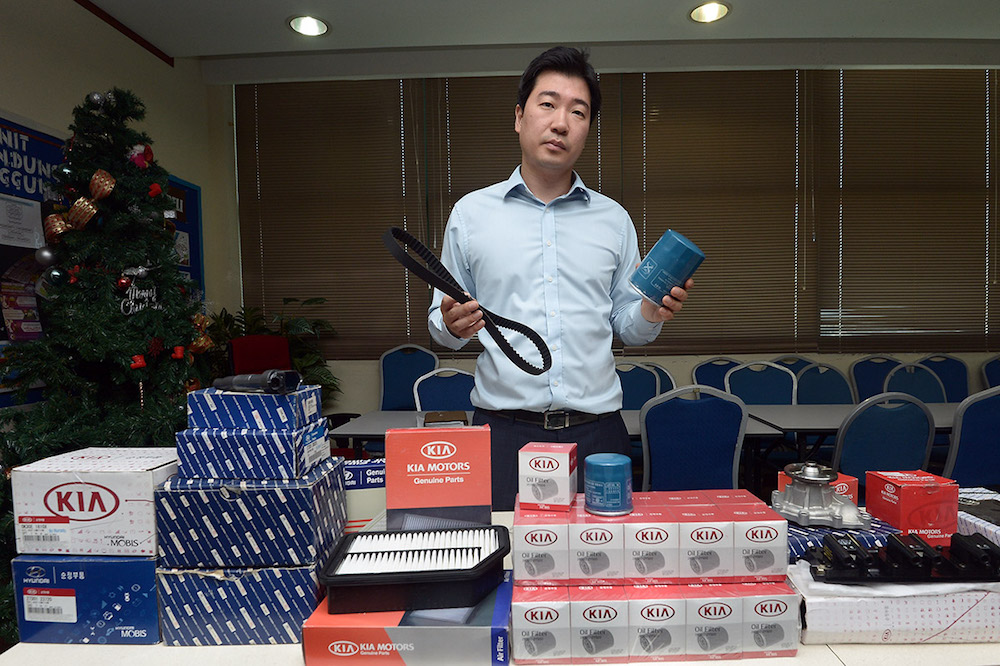 Jaeho Lee of Hyundai Mobis holds examples of the fake auto parts that were seized during raids in Gombak and Puchong at a press conference in Shah Alam June 28 2018. u00e2u20acu201d Picture by Mukhriz Hazim