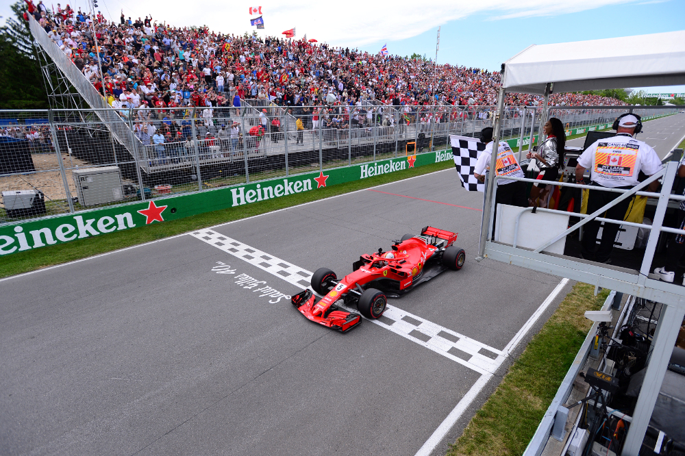 Ferrariu00e2u20acu2122s Sebastian Vettel passes the chequered flag to win the Canadian Grand Prix at Circuit Gilles Villeneuve, Montreal June 10, 2018. u00e2u20acu201d Picture by Paul Chiasson/Pool via Reuters