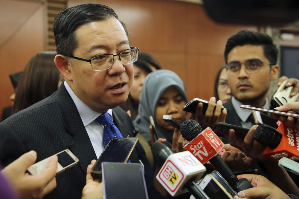 Finance Minister Lim Guan Eng speaks to reporters at Parliament in Kuala Lumpur on July 31, 2018. ― Picture by Yusof Mat Isa