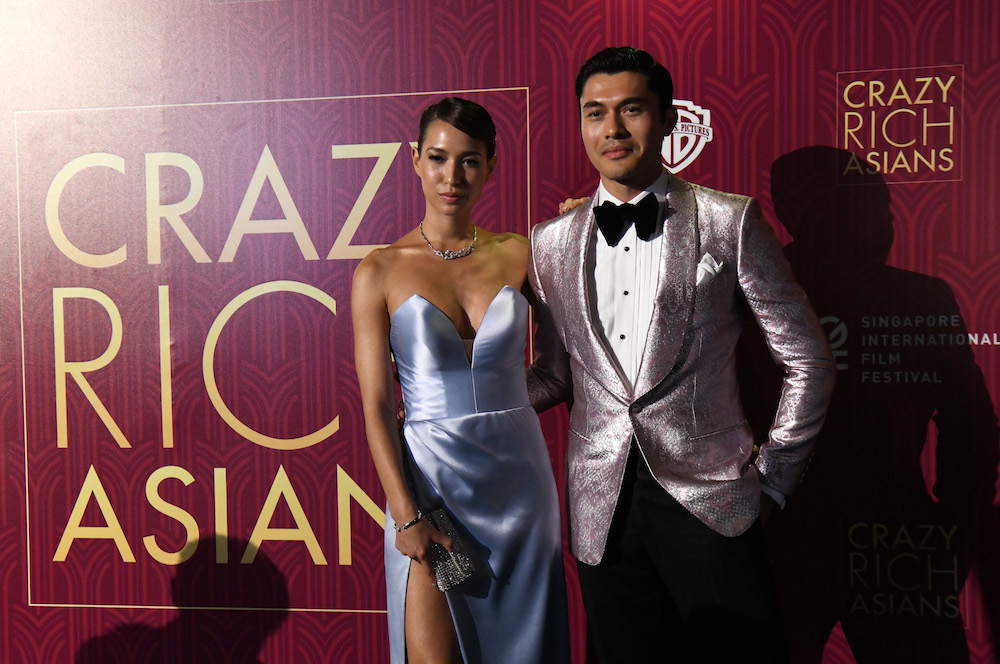 Henry Golding and his wife Liv Lo arrive at the film premiere of u00e2u20acu02dcCrazy Rich Asiansu00e2u20acu2122 in Singapore August 21, 2018. u00e2u20acu201d AFP pic