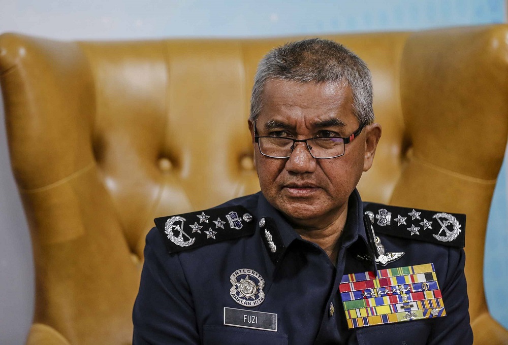 Inspector-General of Police Tan Sri Mohamad Fuzi Harun during a press conference at Bukit Aman in Kuala Lumpur August 14, 2018. u00e2u20acu201d Picture by Firdaus Latif