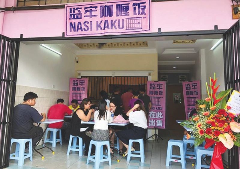 Customers dine at the Nasi Kaku restaurant in Ipoh. u00e2u20acu2022 Picture by Marcus Pheong