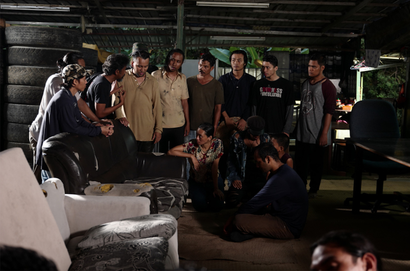 Director Namron (3rd from left) speaks to the cast before shooting a scene. — Picture courtesy of Jazzy Group
