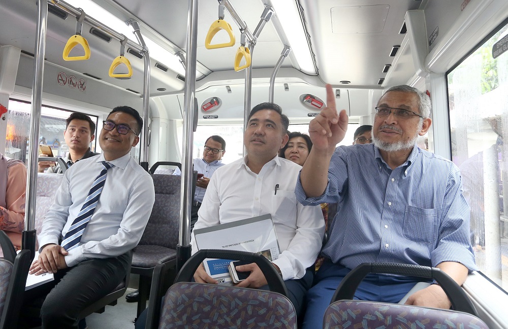 Transport Minister Anthony Loke (second right) and Federal Territories Minister Khalid Samad (left) riding a GoKL bus in Kuala Lumpur October 18, 2018. u00e2u20acu201d Picture by Razak Ghazali