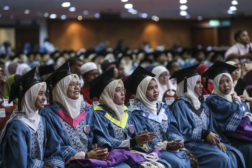 Graduates attend the International Islamic University Malaysiau00e2u20acu2122s 34th convocation ceremony in Gombak November 10, 2018. u00e2u20acu201d Picture by Azneal Ishak