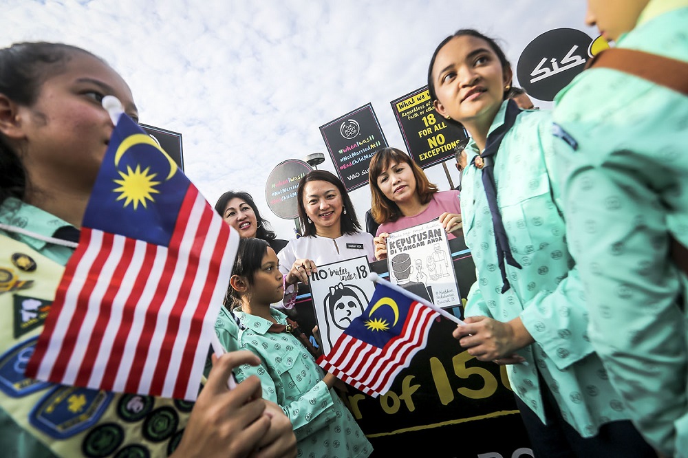 Deputy Women, Family and Community Development Minister Hannah Yeoh (centre) and students protest against child marriage outside the Parliament in Kuala Lumpur November 13, 2018.