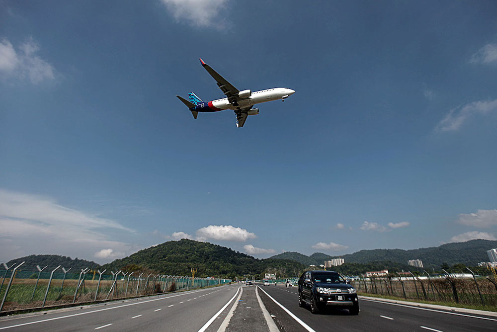 An aeroplane takes off from the Penang International Airport, November 28, 2018. u00e2u20acu201d Picture by Sayuti Zainudin