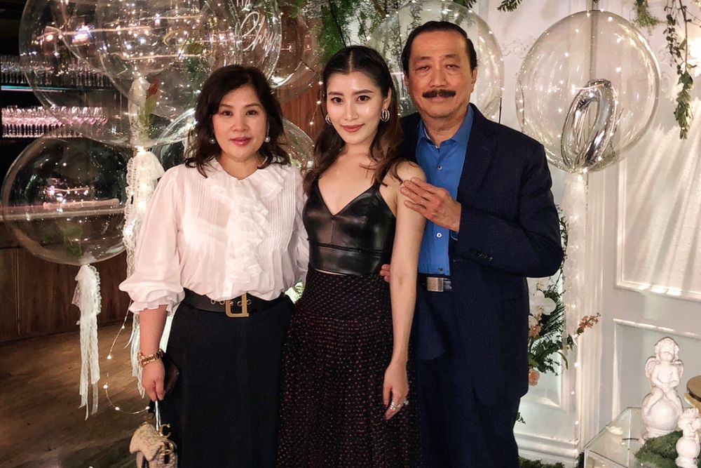 Chryseis Tan (centre) with her mother and father, Tan Sri Vincent Tan (right). u00e2u20acu2022 Pix via Instagram/Chryseis Tan