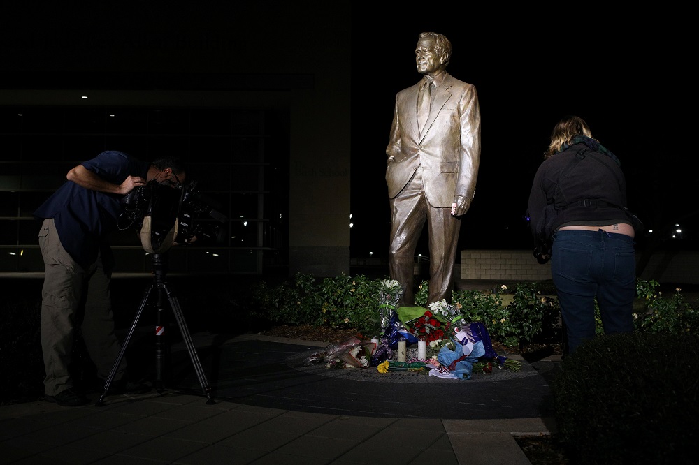 Members of the media film a makeshift memorial at the foot of a statue outside the George H.W. Bush Presidential Library and Museum, a day after the 41st president of the United States died, in College Station, Texas, December 1, 2018. u00e2u20acu201d Reuters pic