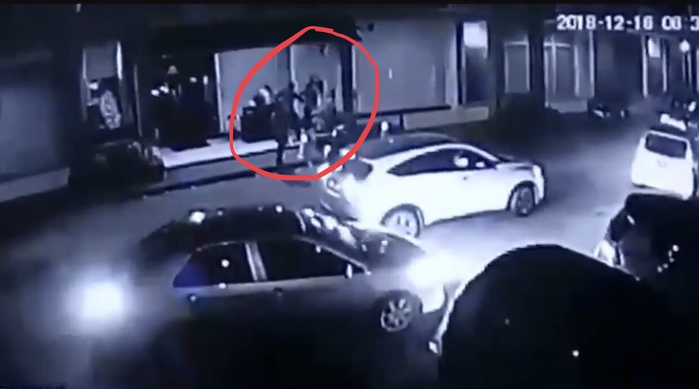The suspects (circled in red) seen slashing the victim Edward Rishal S. Reggie. u00e2u20acu201d Screenshot from CCTV