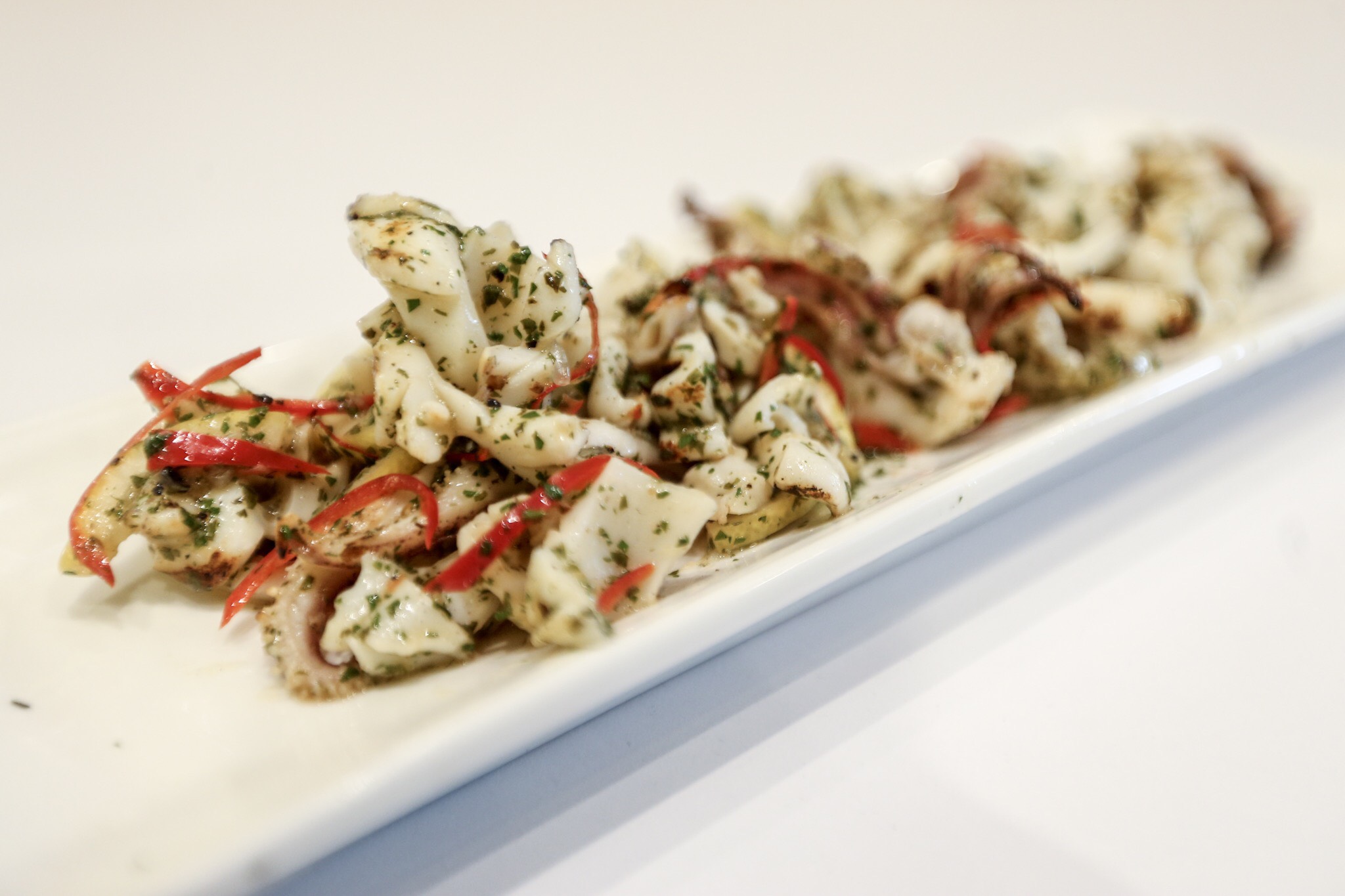 Char Grilled Calamari with Herbs... so delicious you might want more.