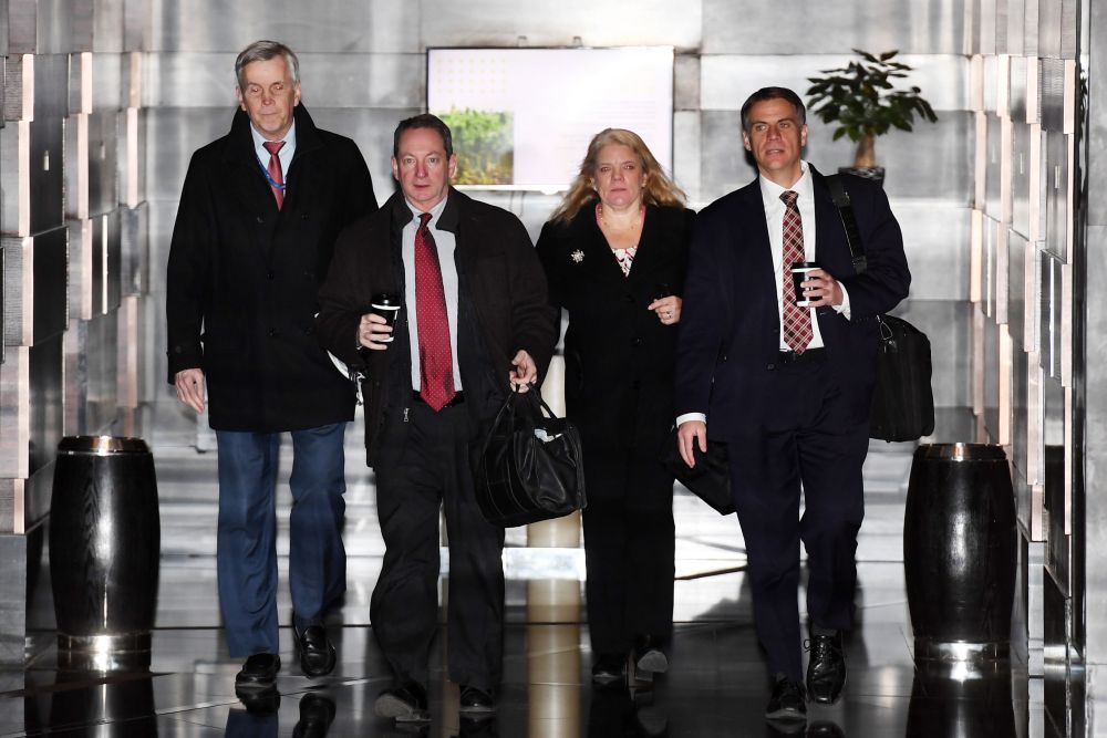 Members of a US negotiation team leave a hotel for the second day of talks in Beijing January 8, 2019. u00e2u20acu201d AFP pic