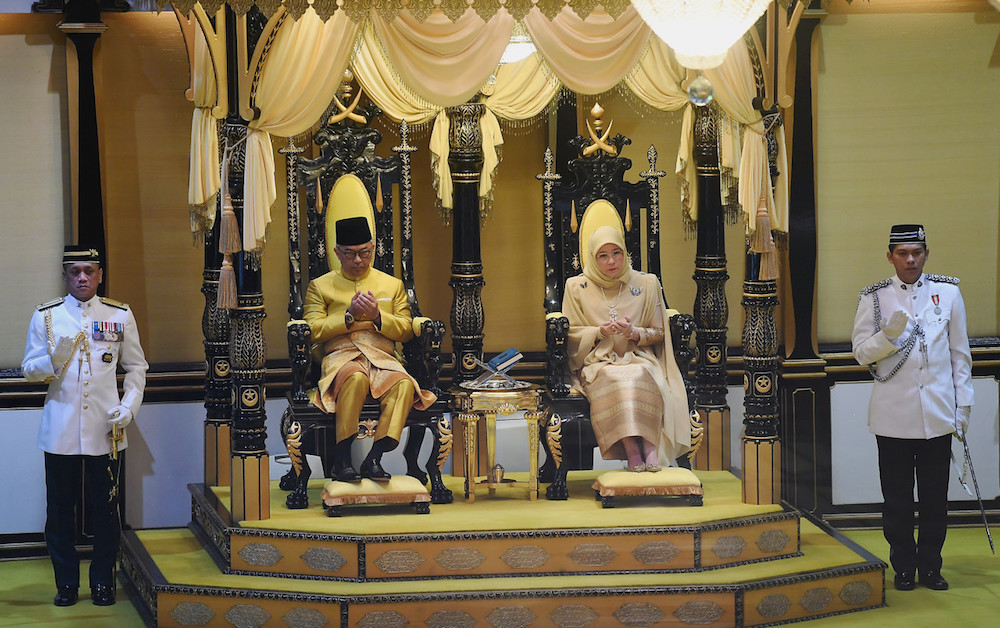 Sultan Abdullah Ahmad Shah and Tengku Puan Pahang Tunku Azizah Aminah Maimunah Iskandariah pray during his coronation at Istana Abu Bakar in Pekan January 15, 2019. u00e2u20acu201d Bernama pic