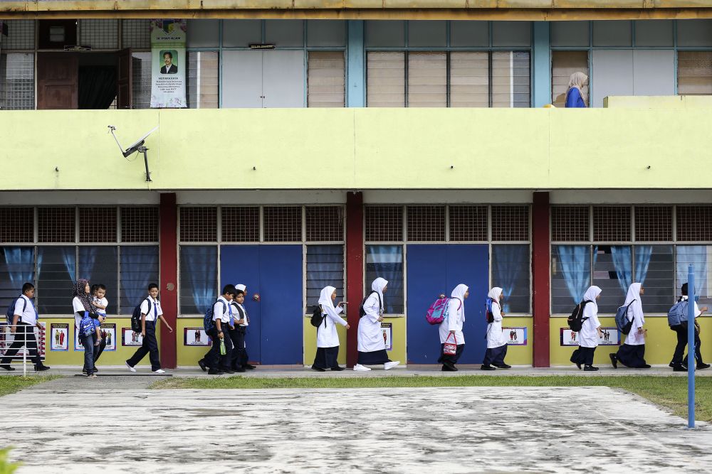 Students attend the first day of school at Sekolah Kebangsaan Shah Alam January 2, 2019. u00e2u20acu2022 Picture by Yusof Mat Isa