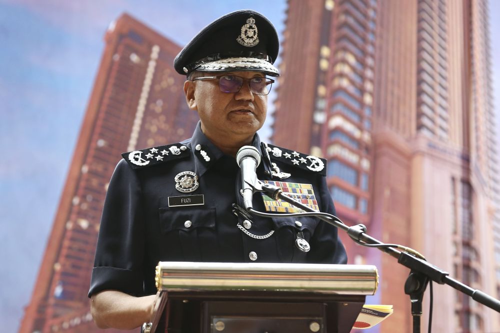 IGP Tan Sri Mohamad Fuzi Harun speaks during a press conference after a crime prevention patrol at the Times Square shopping centre in Kuala Lumpur January 24, 2019. u00e2u20acu2022 Picture by Yusof Mat Isa