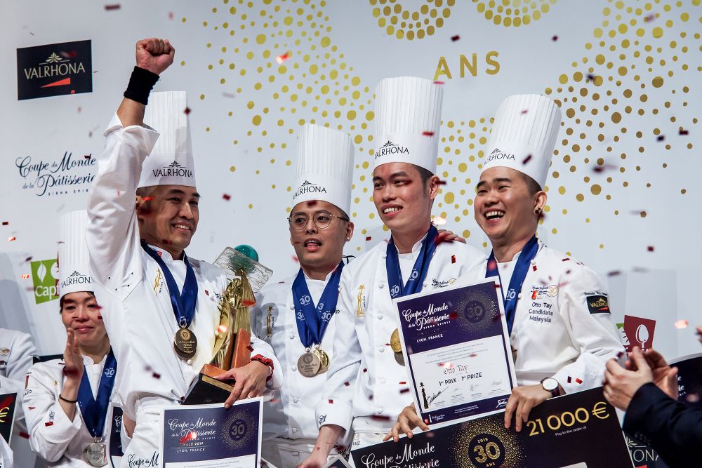 (From left) Chefs Patrick Siau, Loi Ming Ai, Tan Wei Loon and Otto Tay cheer after winning the World Pastry Cup last month at Lyon. u00e2u20acu201d Picture courtesy of Diph Photography