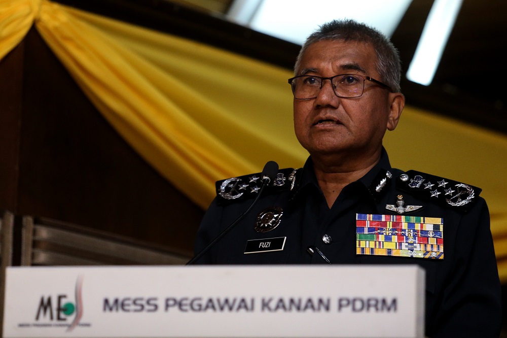 Inspector-General of Police Tan Sri Mohamad Fuzi Harun speaks during the signing of a memorandum of understanding in Bukit Aman March 19,2019. u00e2u20acu201d Picture by Ahmad Zamzahuri 