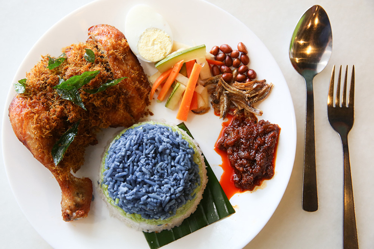 Their nasi lemak '3 Rasa'combines colourful layers for their coconut rice with a juicy ayam berempah goreng, acar and sambal