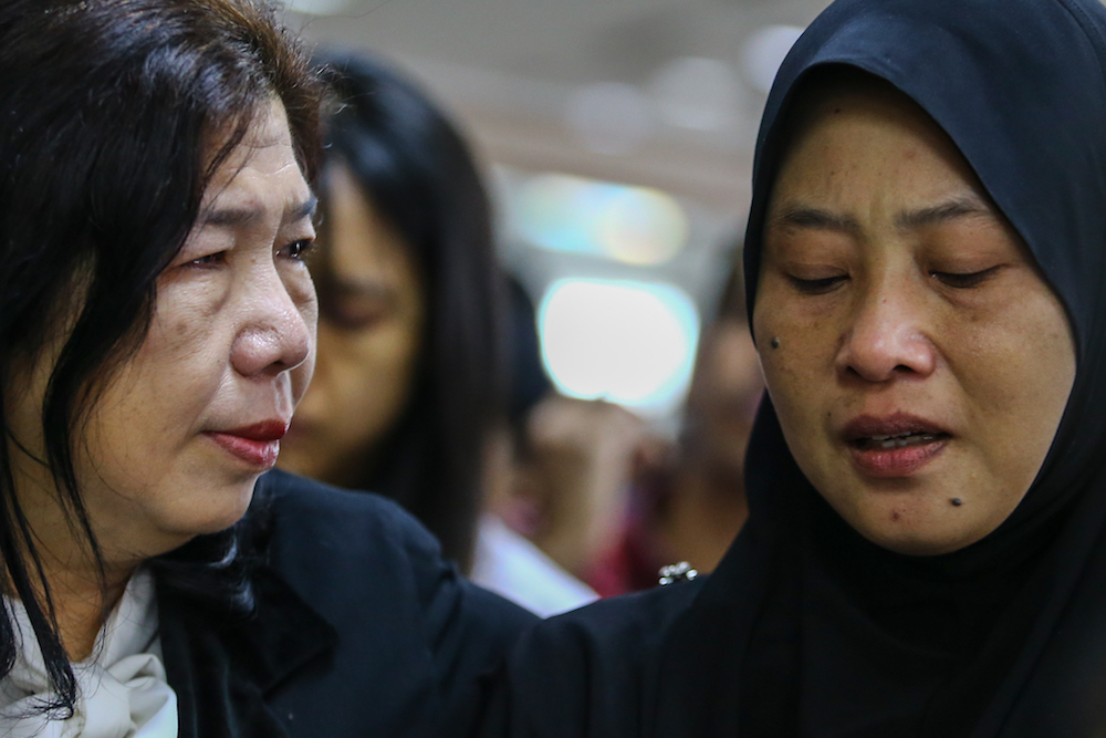 Susanna Liew and Norhayati Mohd Arifin attend the announcement of Suhakamu00e2u20acu2122s public inquiry findings into the disappearances of pastor Raymond Koh and Amri Che Mat in Kuala Lumpur April 3, 2019. u00e2u20acu201d Picture by Hari Anggara