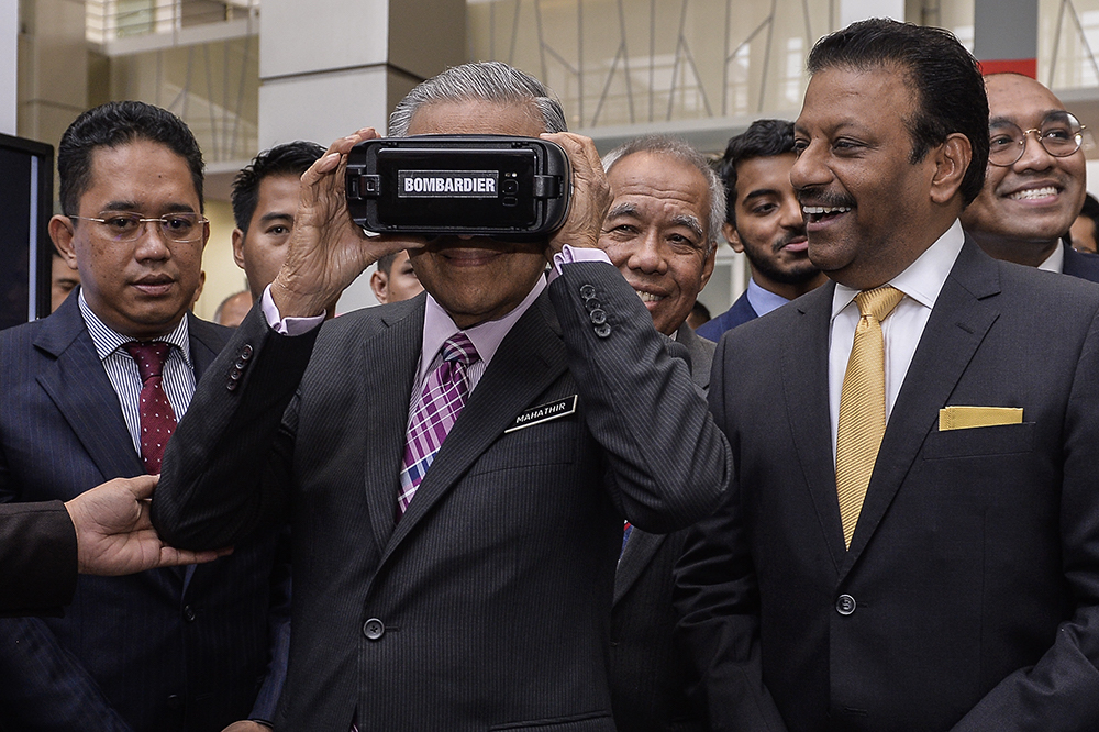 Prime Minister Tun Dr Mahathir Mohamad visits a booth during the MARIC: Moving the Rail Industry Forward exhibition in Cyberjaya April 16, 2019. u00e2u20acu201d Picture by Miera Zulyana