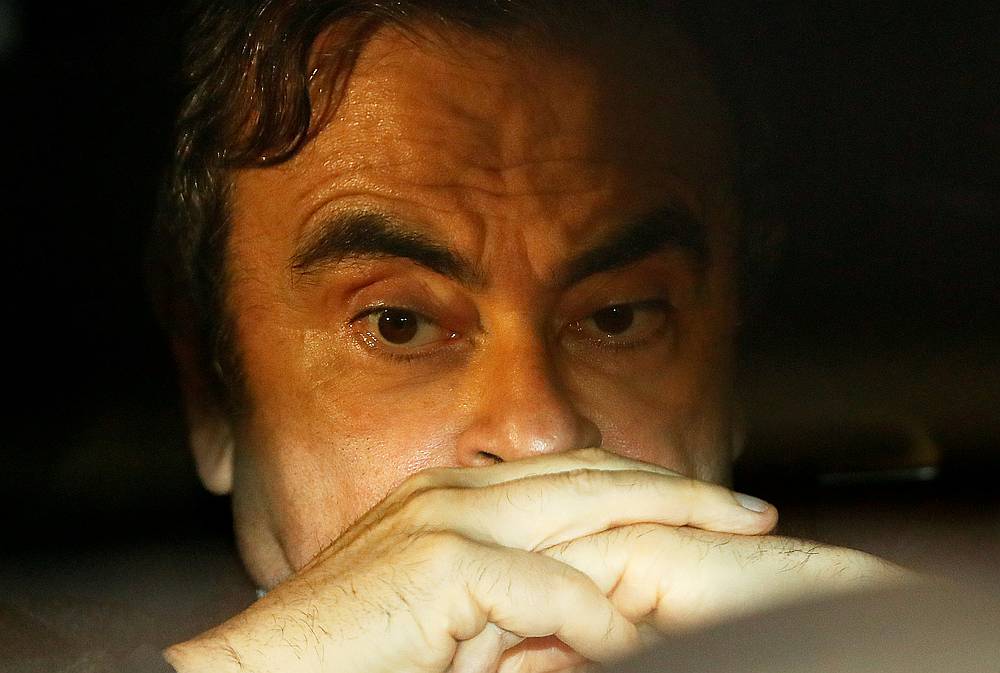 Former Nissan Motor chairman Carlos Ghosn inside a car as he leaves his lawyer's office after being released on bail from Tokyo Detention House, in Tokyo March 6, 2019. u00e2u20acu201d Reuters pic