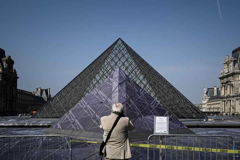 Preparations for an installation by French contemporary artist JR at the Louvre in Paris March 28, 2019. u00e2u20acu201d AFP pic