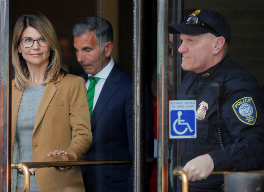 Actor Lori Loughlin, and husband, fashion designer Mossimo Giannulli, facing charges in a nationwide college admissions cheating scheme, leave federal court in Boston April 3, 2019. u00e2u20acu201d Reuters pic