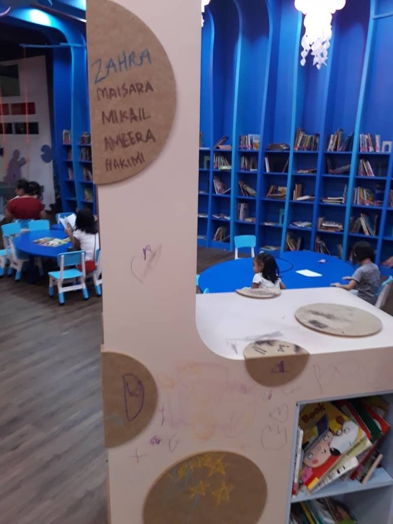 Crayon drawings on the walls are pictured at the children's section of the Sabah state library. — Picture courtesy of Wong Vui Yin