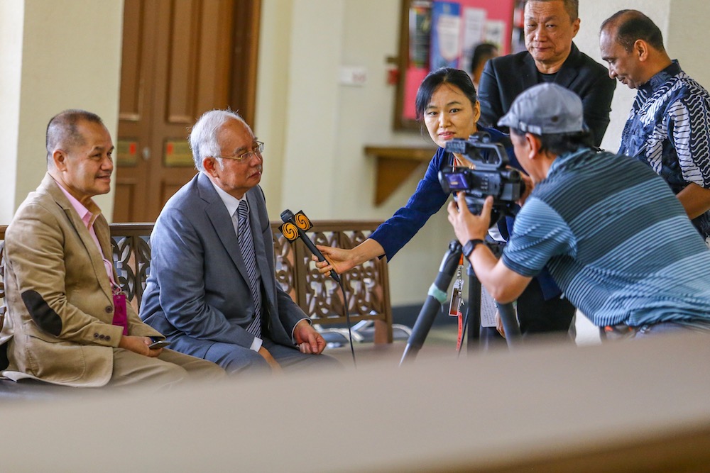 Datuk Seri Najib Razak is interviewed by reporters during a break at the Kuala Lumpur Court Complex May 29, 2019. — Picture by Hari Anggara