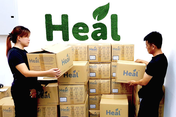 The team at the Heal Nutrition headquarters packing products for delivery