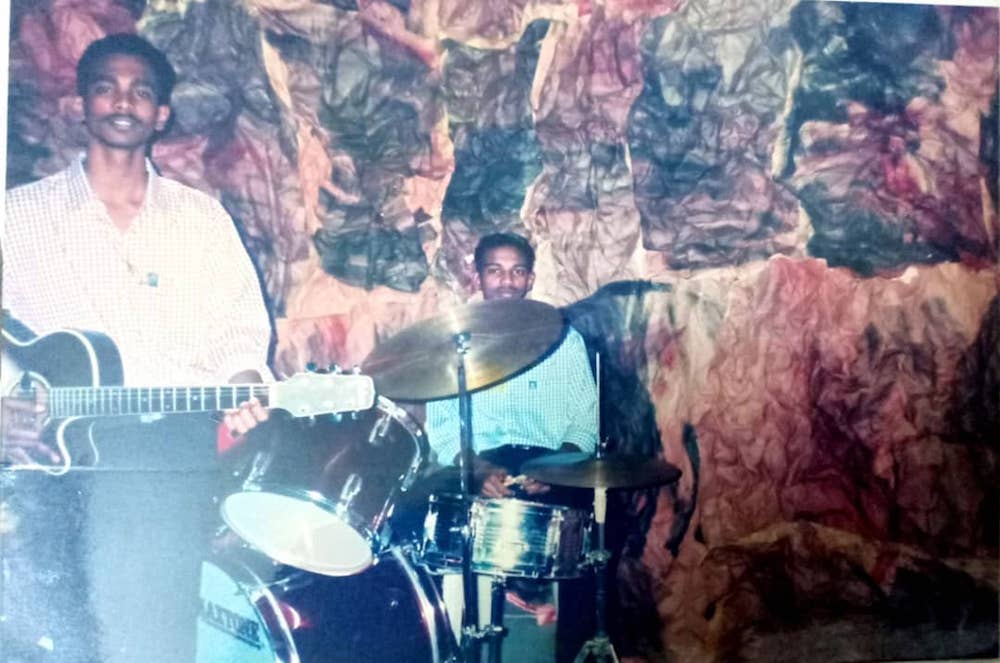 Pannir Selvam, aged 16 or 17, is seen here playing drums in church together with his elder brother Parthiban plays the guitar. — Picture courtesy of Pannir Selvam’s family