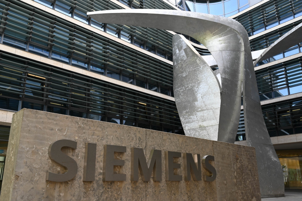 A file photo taken May 8, 2019 shows the logo at the company headquarters building of German industrial giant Siemens in Munich, southern Germany. u00e2u20acu201d AFP pic