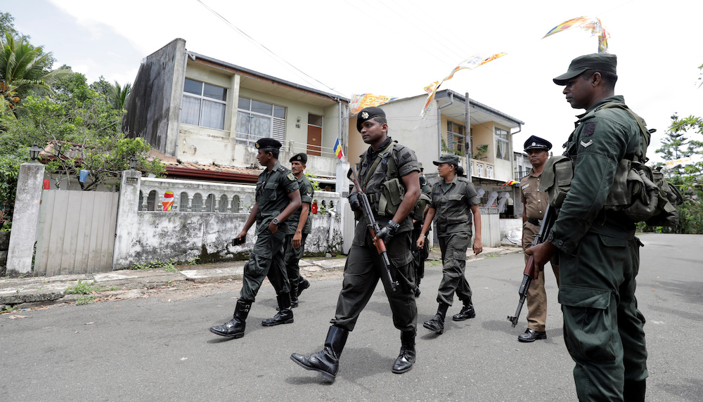 Sri Lankan army soldiers patrol on a road while other soldiers search houses during a special cordon and search operation conducted by the military in Sri Lankau00e2u20acu2122s capital Colombo and suburbs in Mattegoda, Sri Lanka May 25, 2019. u00e2u20acu201d Reuters pic