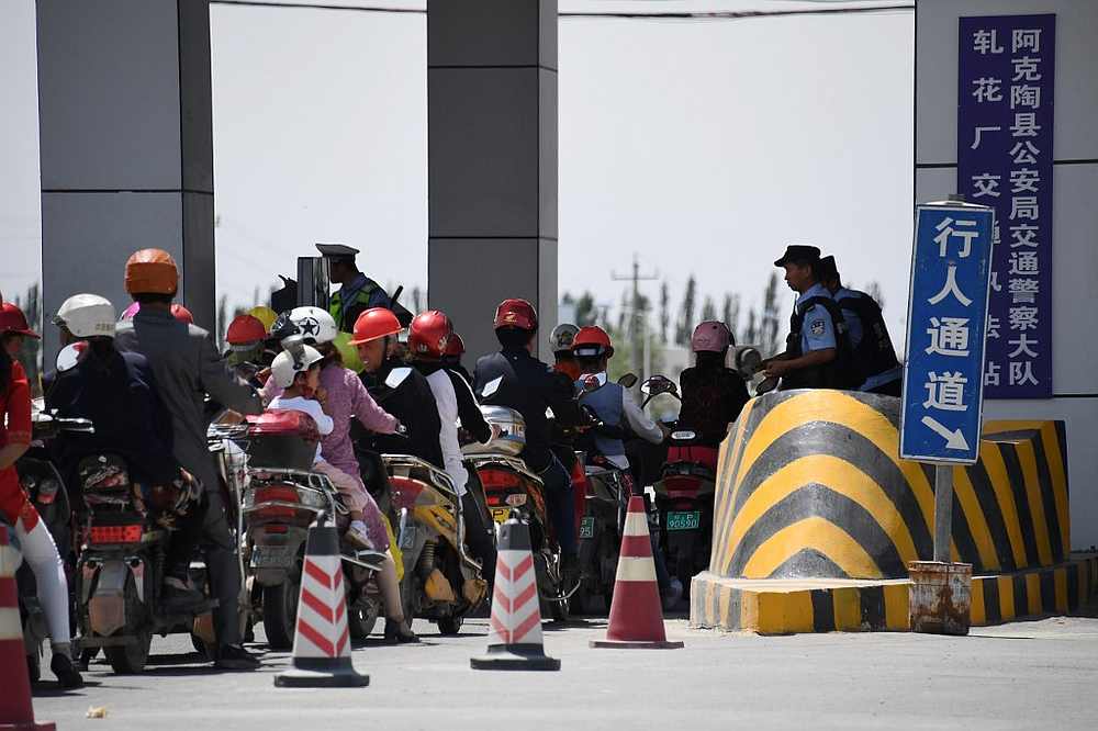 A police checkpoint on a road near a facility believed to be a re-education camp where mostly Muslim ethnic minorities are detained, north of Akto in China's western Xinjiang region June 4, 2019. u00e2u20acu201d AFP pic