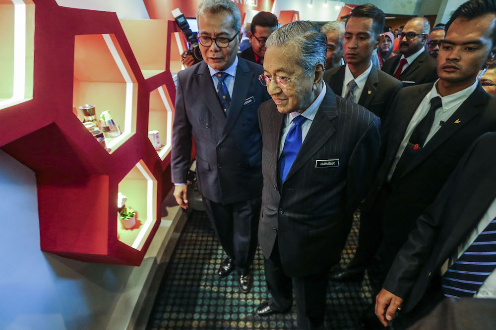 Prime Minister Tun Dr Mahathir Mohamad with Entrepreneur Development Minister Datuk Seri Mohd Redzuan Yusof at the launch of the National Entrepreneurship Policy at the KL Convention Centre, July 11, 2019.  u00e2u20acu201d Picture by Hari Anggara