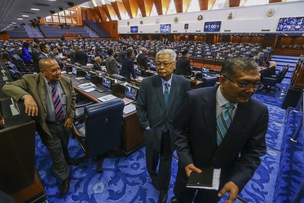 Members of the Opposition stage a walkout at the Dewan Rakyat in Kuala Lumpur July 17, 2019. u00e2u20acu201d Picture by Hari Anggara