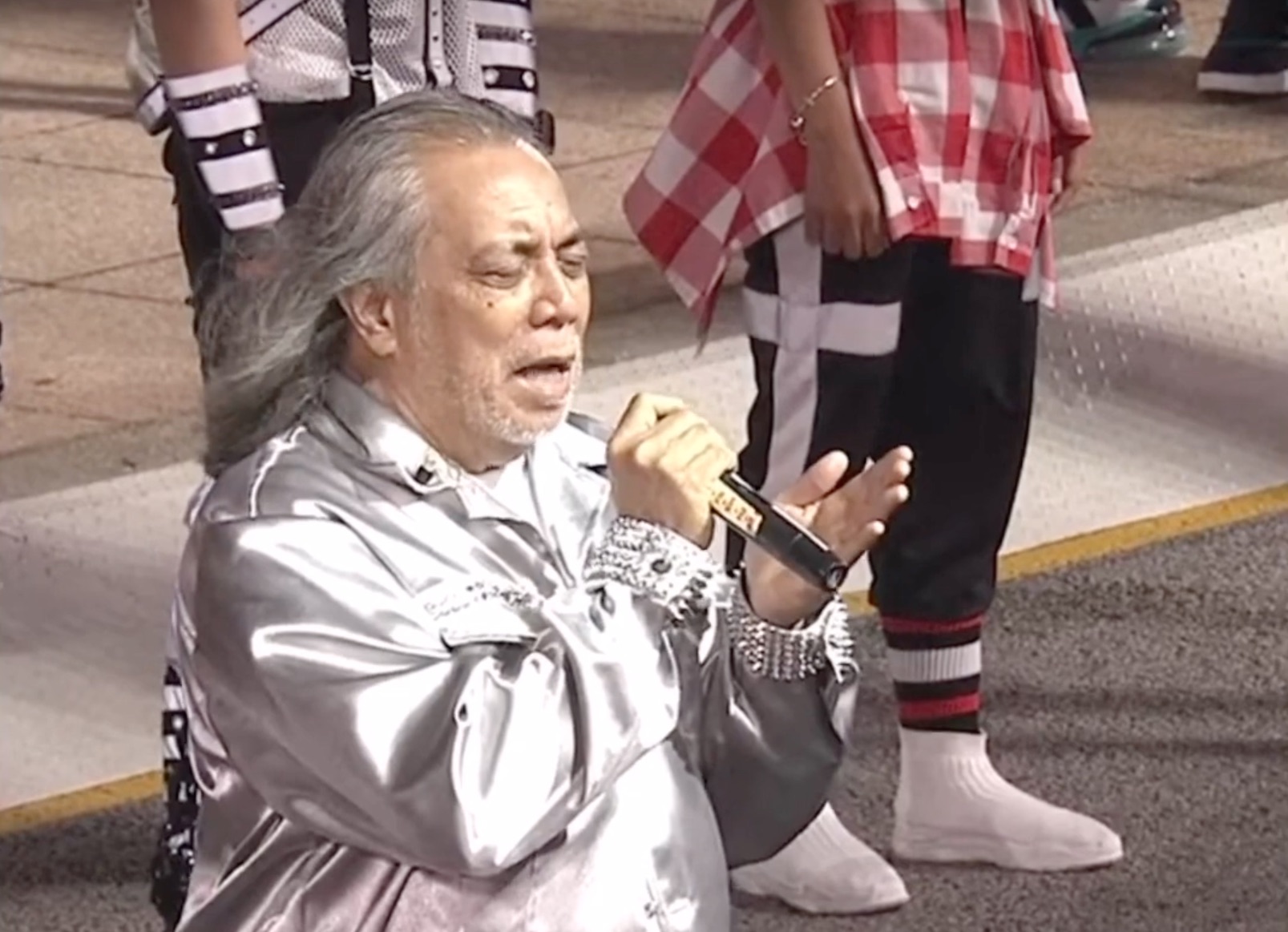 The veteran singer became the target of racist comments following his downtempo version of Singaporeu00e2u20acu2122s national anthem. u00e2u20acu201d Screengrab from YouTube